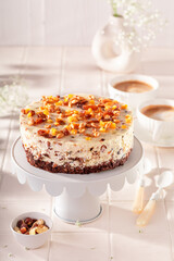 Sweet walnut cheesecake served with coffee in summer.