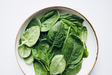 Fresh spinach leaves create a vibrant and healthy theme