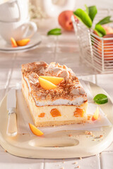 Homemade peach cheesecake made with cocoa and peaches.