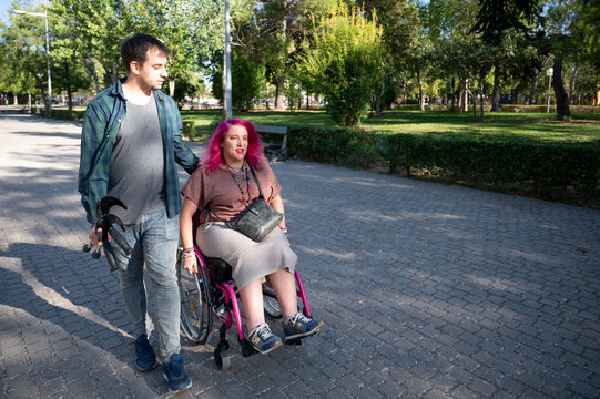 Couple on a college campus embracing disability with love and support