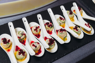 Catering table, beautifully decorated banquet with variety different food snacks appetizers on christmas corporate birthday party event or wedding celebration, canape, salad, delicatessen setting