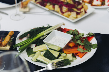 Catering table, beautifully decorated banquet with variety different food snacks appetizers on christmas corporate birthday party event or wedding celebration, canape, salad, delicatessen setting