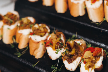 Catering table, beautifully decorated banquet with variety different food snacks appetizers on christmas corporate birthday party event or wedding celebration, canape, salad, delicatessen setting