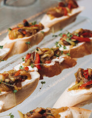 Catering table, beautifully decorated banquet with variety different food snacks appetizers on christmas corporate birthday party event or wedding celebration, canape, salad, delicatessen setting