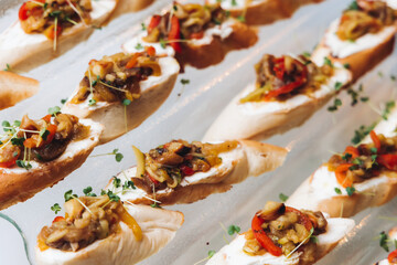 Catering table, beautifully decorated banquet with variety different food snacks appetizers on christmas corporate birthday party event or wedding celebration, canape, salad, delicatessen setting