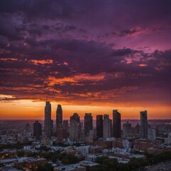 Fototapeta premium A vivid sunset casting a purple and orange glow over a city skyline.