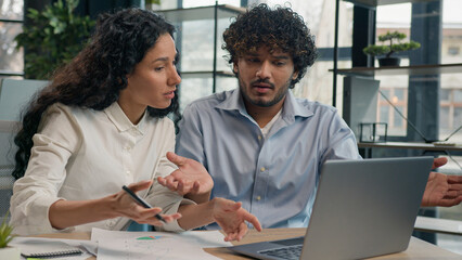 Professional mentor Arabian businesswoman help teach Indian worker analysis explain web project...