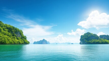 Fototapeta premium Tranquil Blue Ocean with Lush Green Islands Under Bright Sky and White Clouds Creating Serene Coastal Landscape Ideal for Nature and Travel Themes