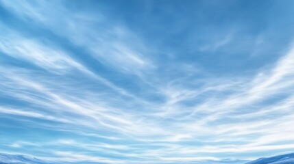Serene Blue Sky with Soft Clouds Over Calm Snowy Landscape