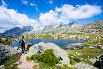 Young hiker woman in Vall de Boi, Aiguestortes and Sant Maurici National Park, Spain