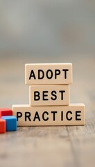 Wooden blocks stacked to spell adopt best practice on a wooden surface with blurred background - obrazy, fototapety, plakaty