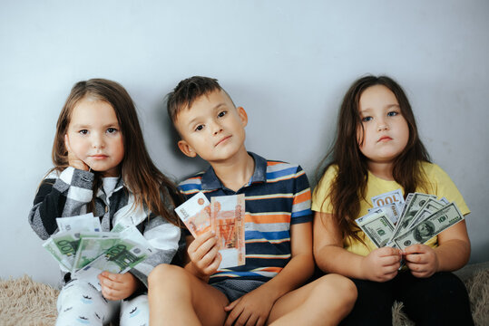 Kids Holding Money with Serious Faces