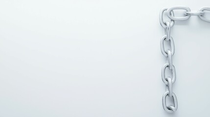Fototapeta premium A close-up of a silver chain against a minimalist white background.