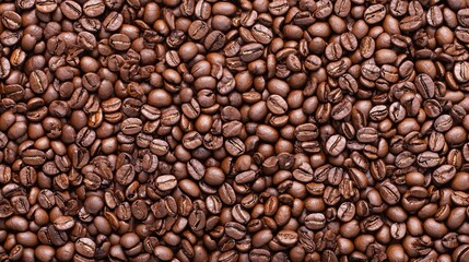Obraz premium A close-up view of roasted coffee beans, showcasing their rich color and texture.