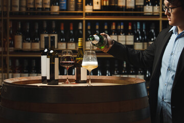 Sommelier Pouring Sparkling Wine in Cellar