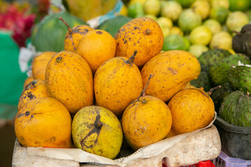 Fruits and vegetables at a local market in Sri lanka. Tropical or exotic fruits on the street in Asia.