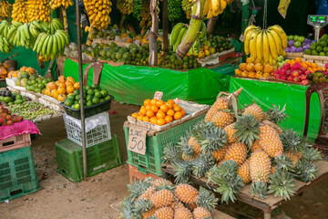 Fruits and vegetables at a local market in Sri lanka. Tropical or exotic fruits on the street in Asia.