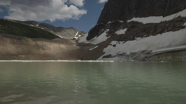 A pristine alpine lake beneath Mount Edith Cavell in the Canadian Rocky Mountains
