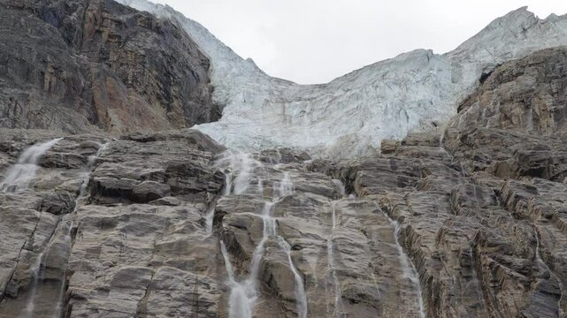 A majestic glacier and cascading waterfalls on Mount Edith Cavell, Canadian Rockies