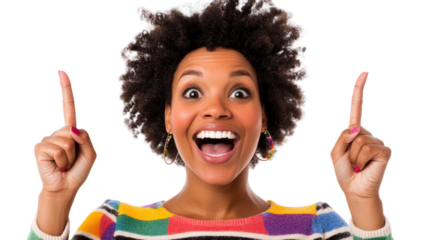 A joyful woman with curly hair raises her fingers to signal excitement, wearing a colorful striped sweater against a white background.