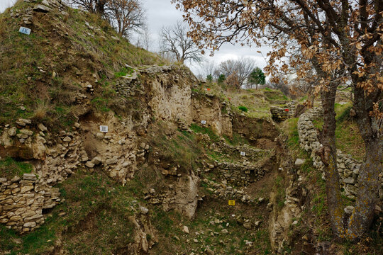 Troy, Anatolia, Turkey. Labelled exposed sections of the ancient ruins showing habitation levels I to IX dating from 3000 BC