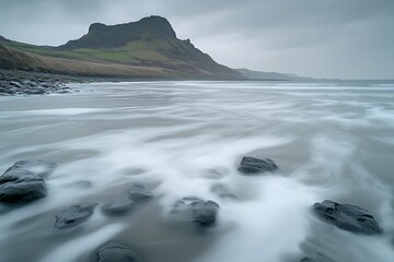 Fototapeta premium Coastal Serenity: Misty Waves Kissing the Shore