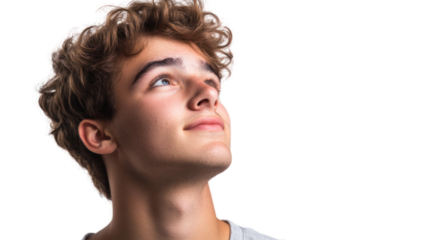 A young man with curly hair gazing upwards, showcasing a thoughtful expression, with a soft, inviting smile against a white background.