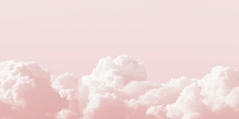 Dreamy light pink sky with cotton-like clouds creating a serene and peaceful minimalistic backdrop perfect for calming visuals.