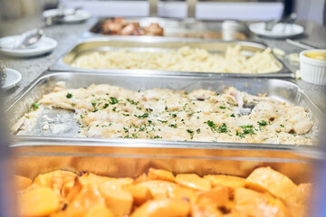 Close-up of a metal container with baked food. To give free food to starving people. With space to copy. High quality photo