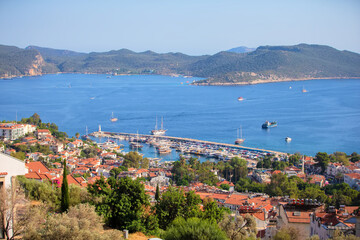 Beautiful coastal town with small white houses taken from above. Houses by the sea.