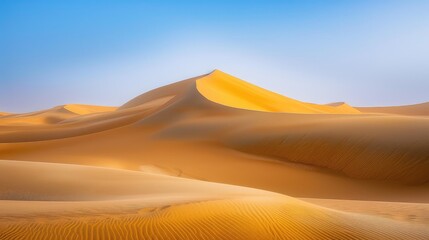 Golden Sand Dunes Against Clear Blue Sky