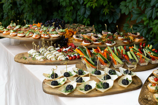 delicious hearty sandwich snacks on a wooden tray at a banquet