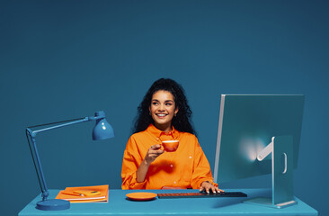 Receptionist working at desk with computer and keyboard