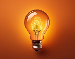 glowing light bulb on orange background idea concept