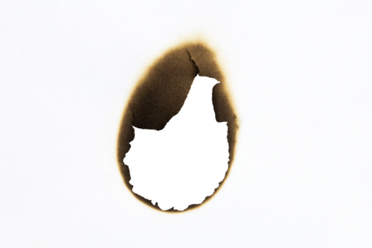 Burned hole on a white paper with clipping path.