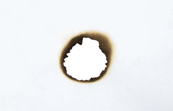 Burned hole on a white paper with clipping path.