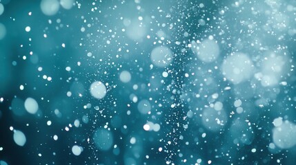 Abstract teal bokeh background with sparkles. Ideal for adding a dreamy, magical feel to designs, enhancing winter or holiday themes.