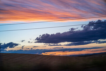 Dramatic Sunset in Spanish Countryside with Clouds and Vibrant Colors