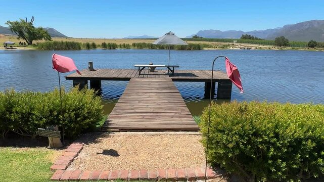 A pier overlooking a large lake near Franschoek In the Winelands of South Africa.