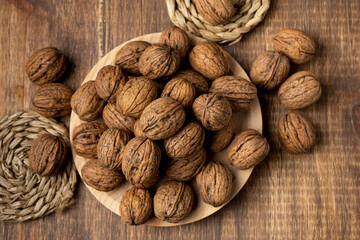 walnuts on a wooden plate top view