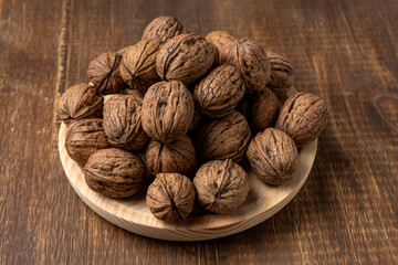 walnuts on a wooden plate