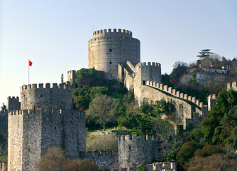 Southern towers of the Rumelihisari Rumelian Roumeli Hissar Castle fortress rise above the Bosphorus. Sariyer, Istanbul, Turkey