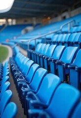 Obraz premium Blue tribunes. seats of tribune on sport stadium. empty outdoor arena. concept of fans. chairs for audience. cultural environment concept. color and symmetry. empty seats. modern stadium