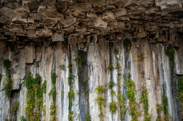 Obraz premium The Symphony of Stones in Garni, Armenia, hexagonal rock formations. There are green plants and grass