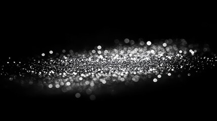 Glittering silver bokeh on deep black, luxurious and dramatic lighting effect