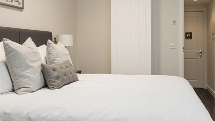 Inviting hotel room with plush double bed and modern decor