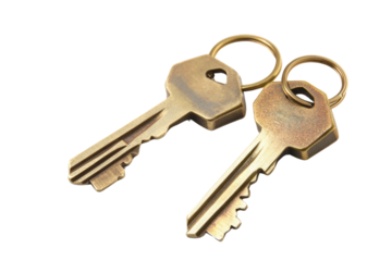House key pair with metal house shaped keyring isolated on white background. PNG


