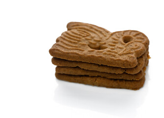 Delicious gingerbread cookies stacked artistically on a clean surface ready to be enjoyed