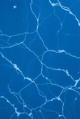 Abstract Blue Water Surface with Marble-Like Veins and Textures