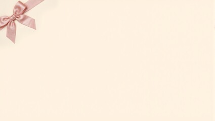 Obraz premium Delicate blush pink ribbon bow on beige backdrop